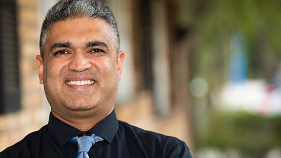 dr motwani talking about implant supported dentures